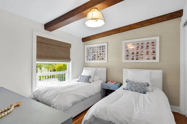 a bathroom with a double vanity sink mirror and toilet