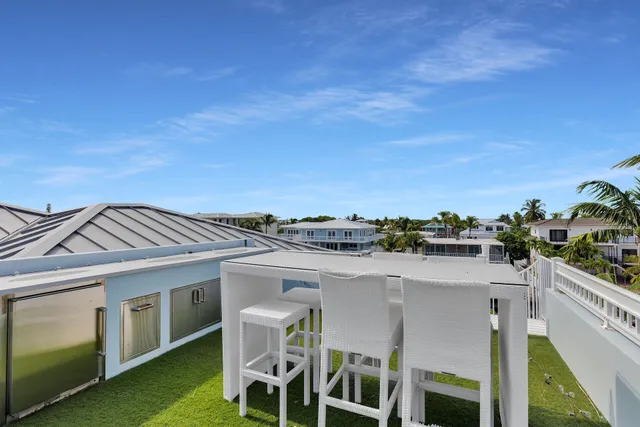 a bathroom with a granite countertop sink toilet and a mirror
