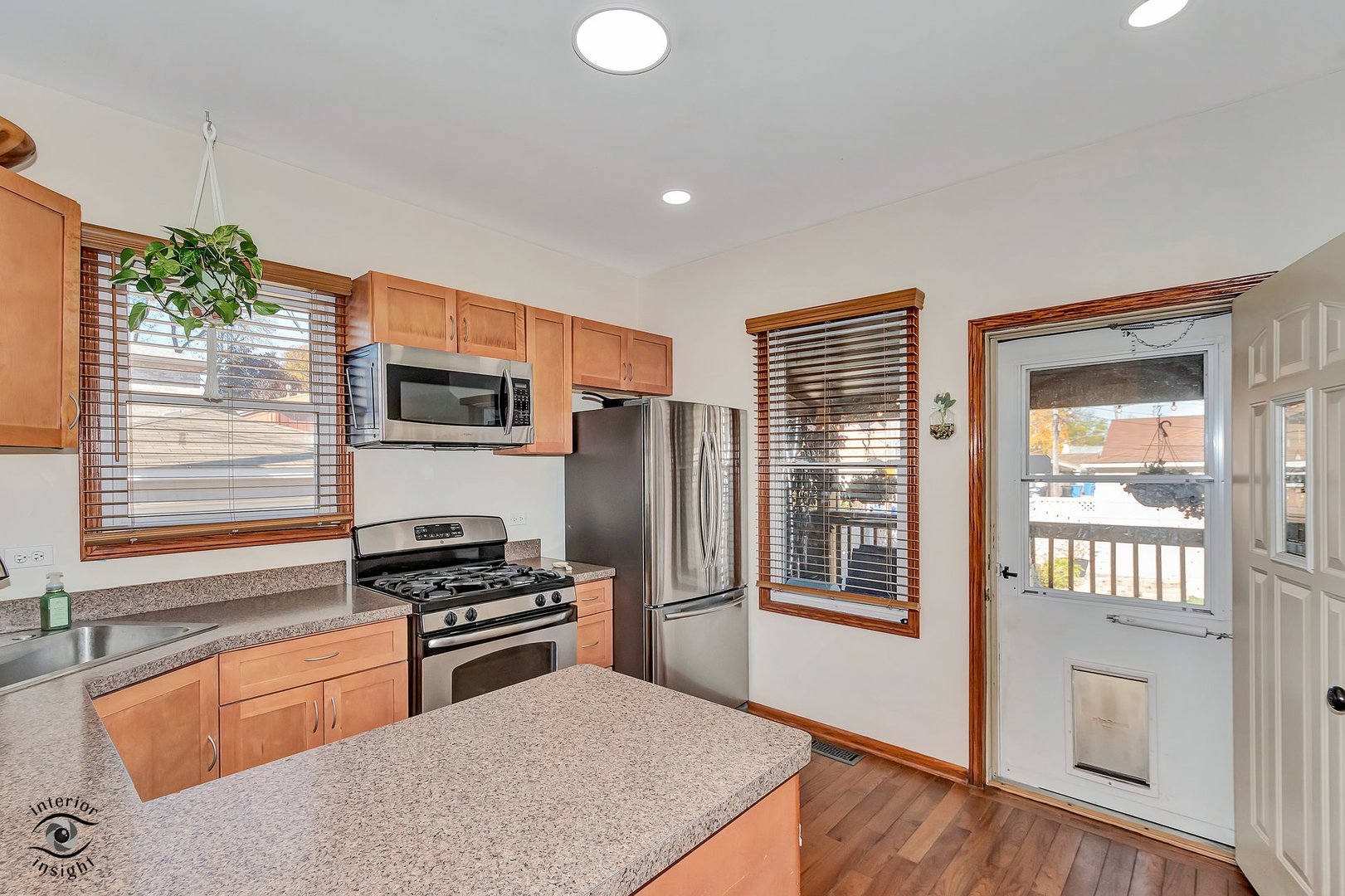 642 West 37th Street Chicago, IL 60609 - Photo 15 of 31 a kitchen with stainless steel appliances granite countertop a refrigerator and a sink