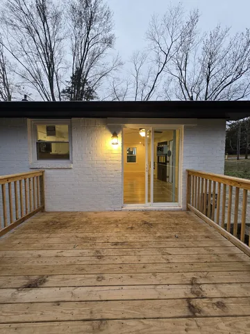 a kitchen with stainless steel appliances granite countertop a sink and a stove
