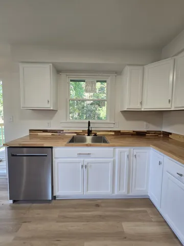 a kitchen with a refrigerator stove and microwave