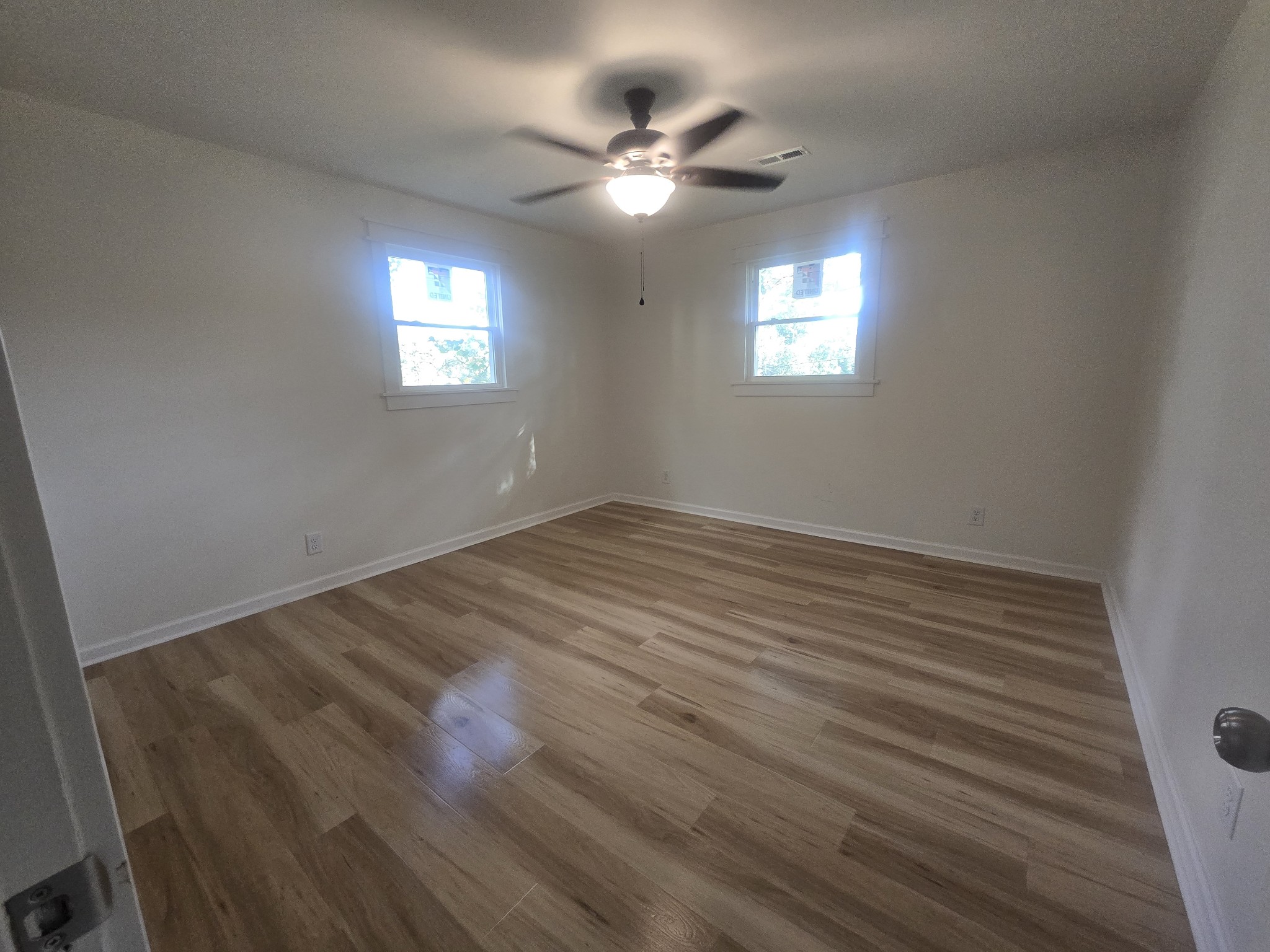 223 Raymond Hodges Road Cottontown, TN 37048 - Photo 20 of 37 wooden floor in an empty room with a window