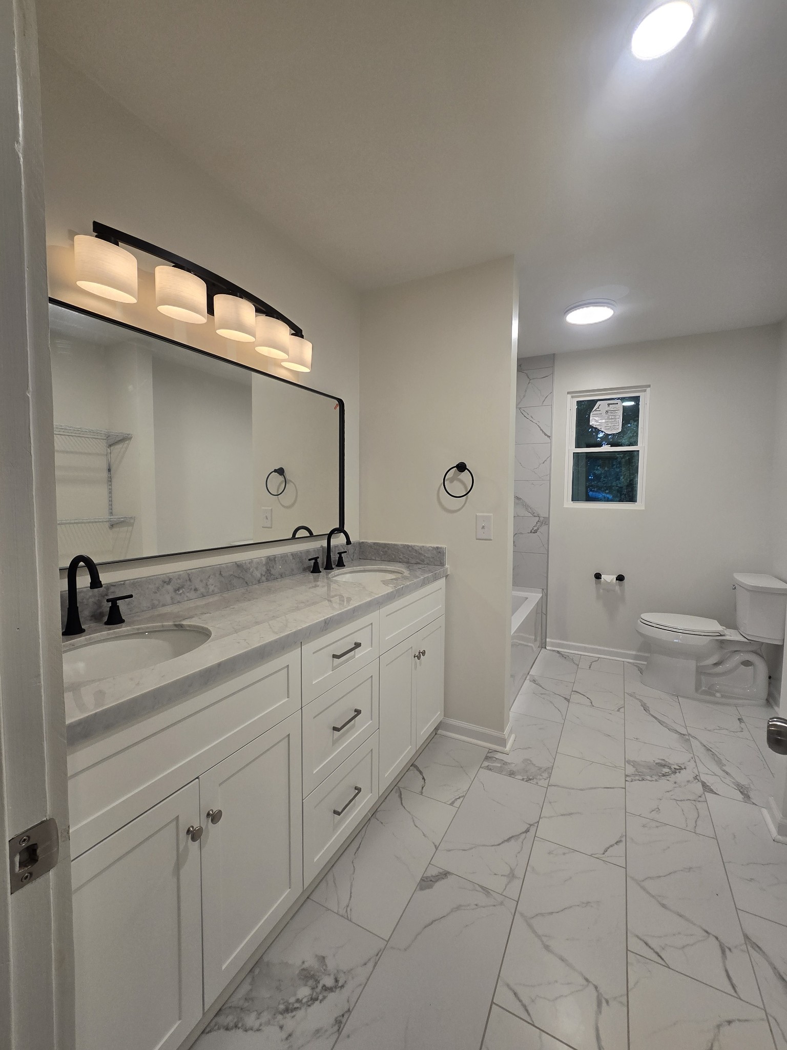 223 Raymond Hodges Road Cottontown, TN 37048 - Photo 21 of 37 a spacious bathroom with a granite countertop sink and a mirror