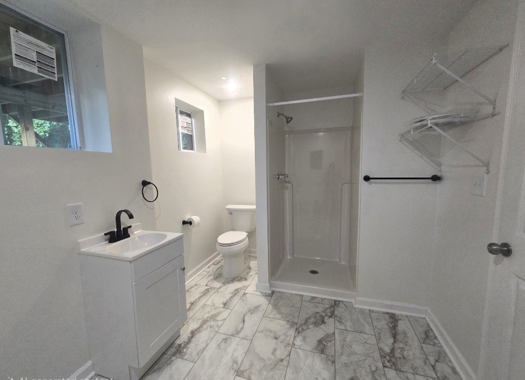 223 Raymond Hodges Road Cottontown, TN 37048 - Photo 32 of 37 a bathroom with a sink toilet and shower