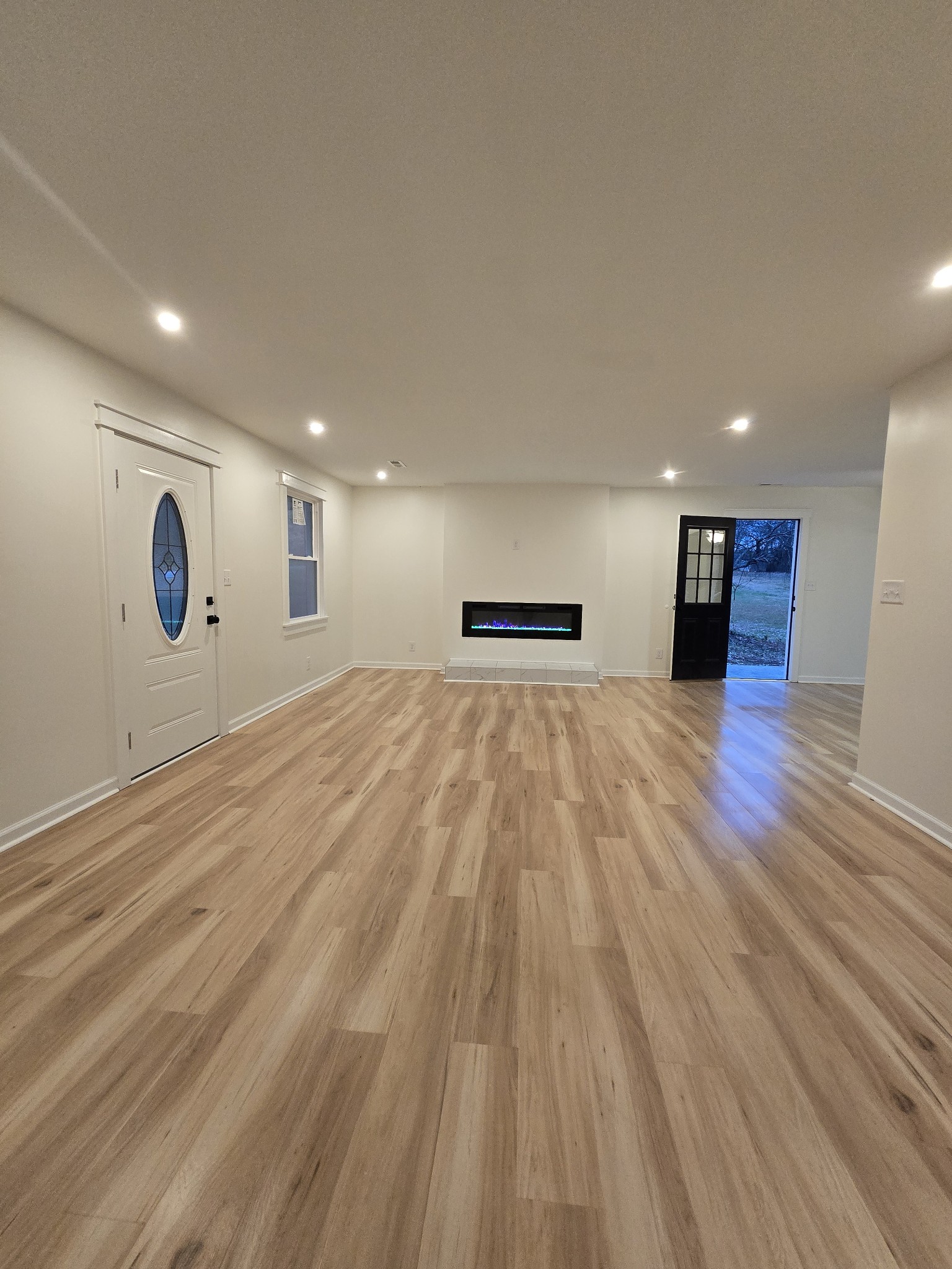 223 Raymond Hodges Road Cottontown, TN 37048 - Photo 6 of 37 a view of an empty room with wooden floor