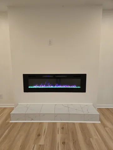 a view of balcony with wooden floor and fence