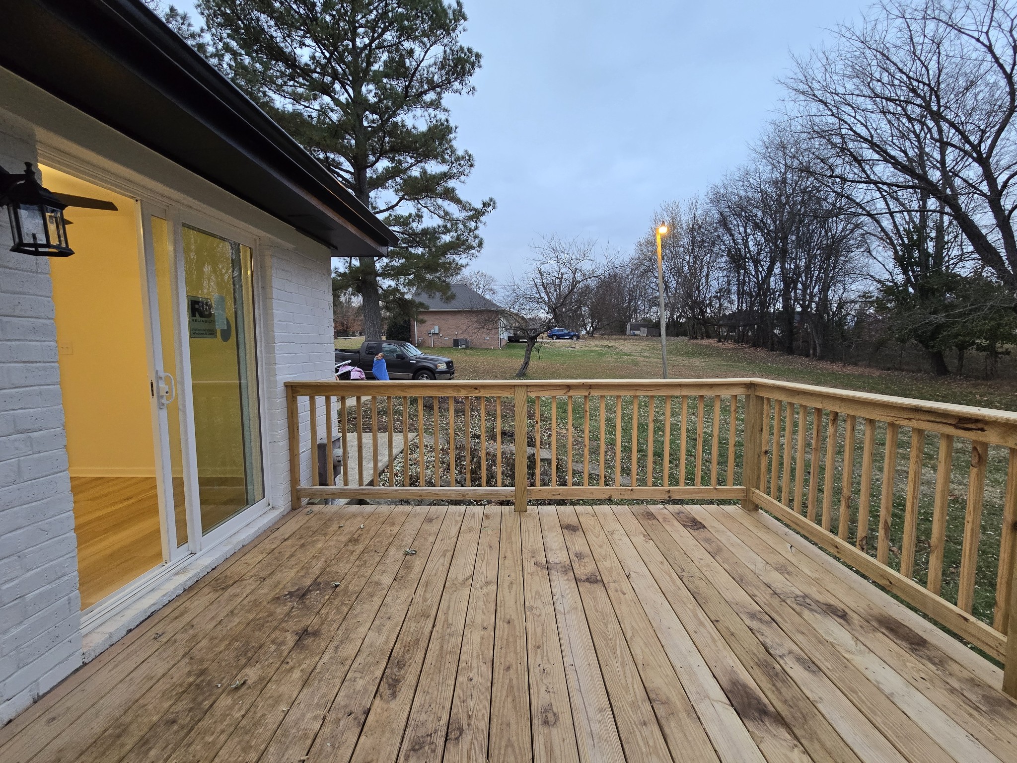 223 Raymond Hodges Road Cottontown, TN 37048 - Photo 10 of 37 a balcony with wooden floor and fence