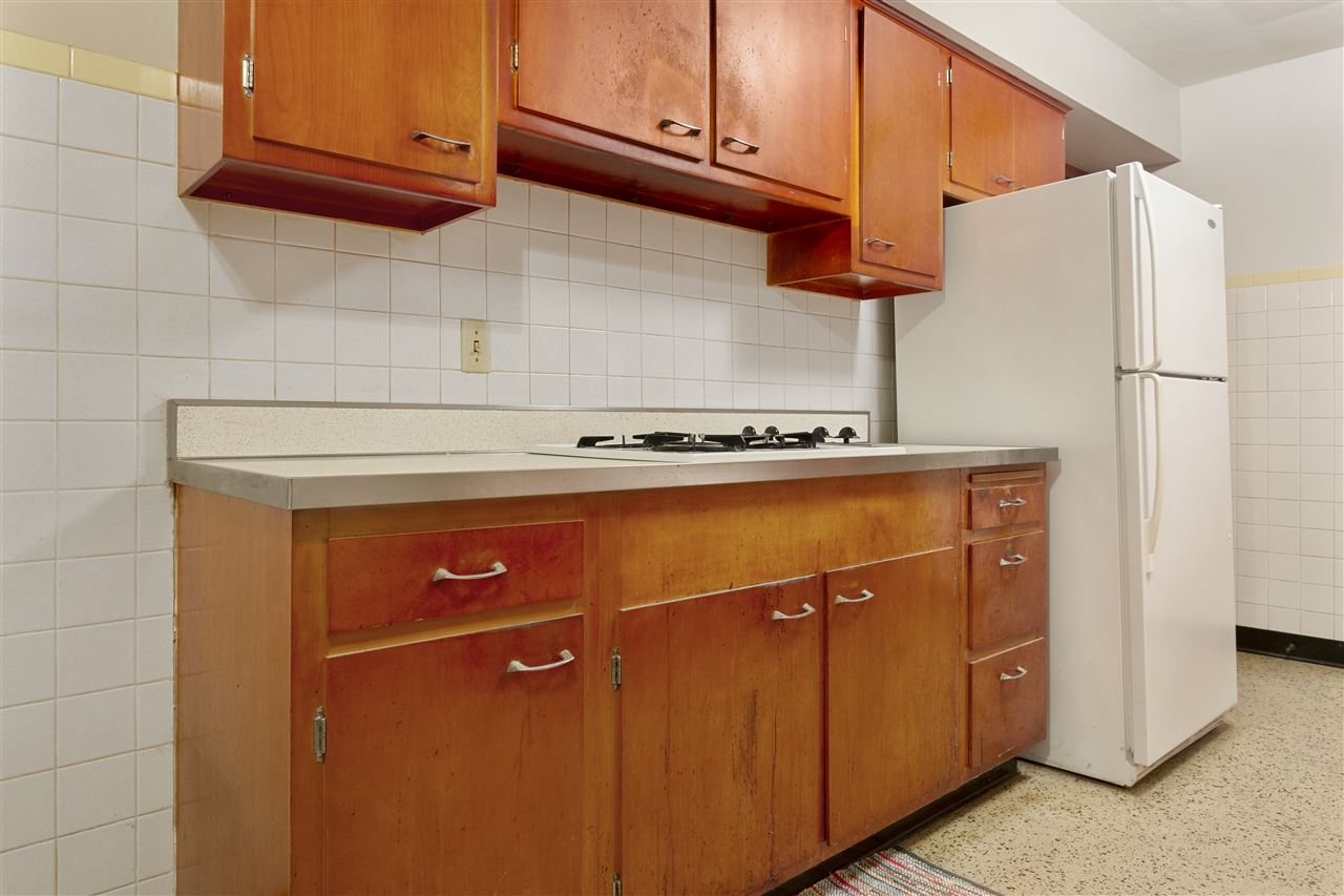3826 Highcrest Road Rockford, IL 61107 - Photo 4 of 13 a close view of a refrigerator a stove and cabinets