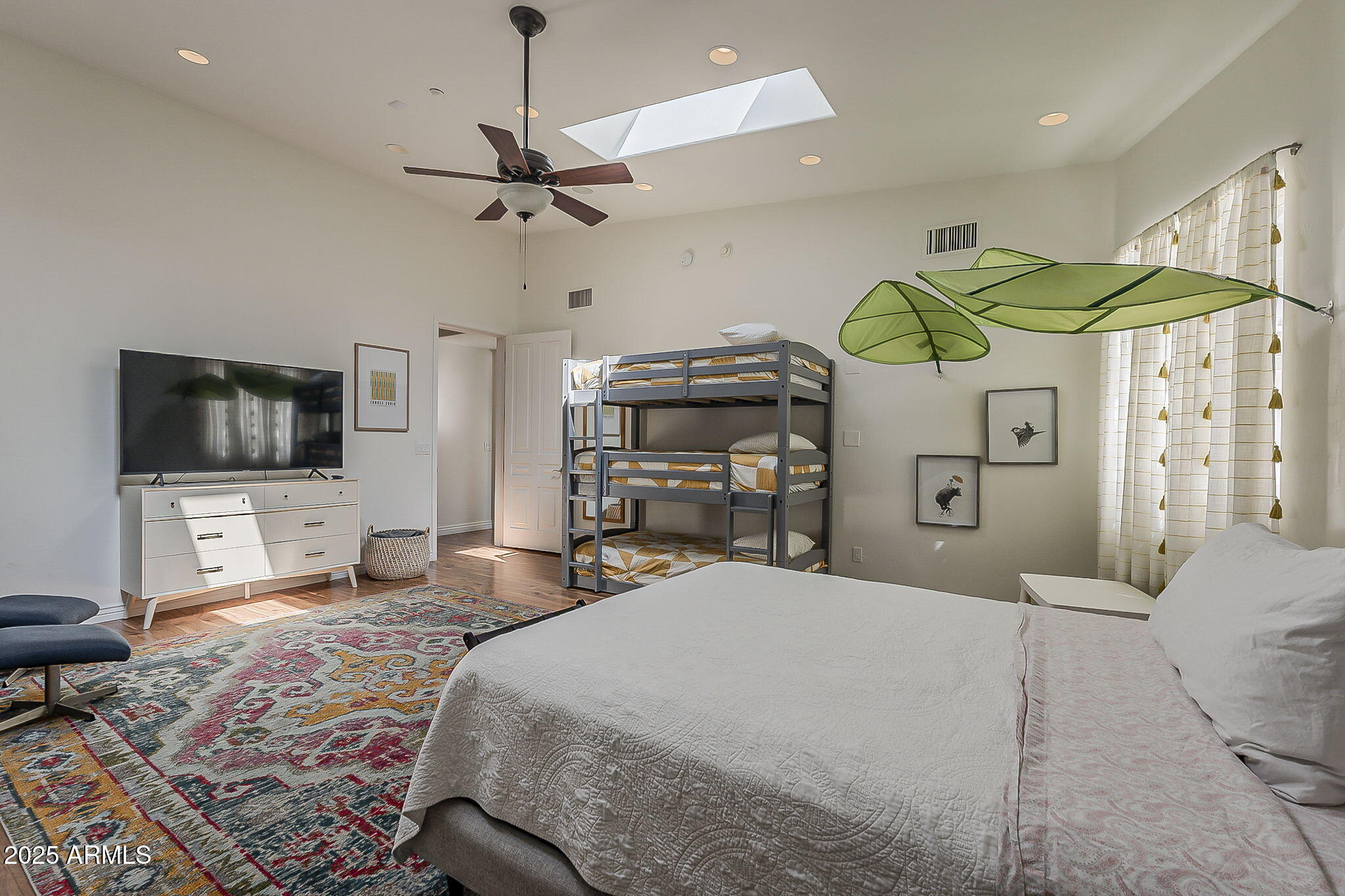 225 West Orchid Lane Phoenix, AZ 85021 - Photo 21 of 70 a bedroom with a bed and flat screen tv