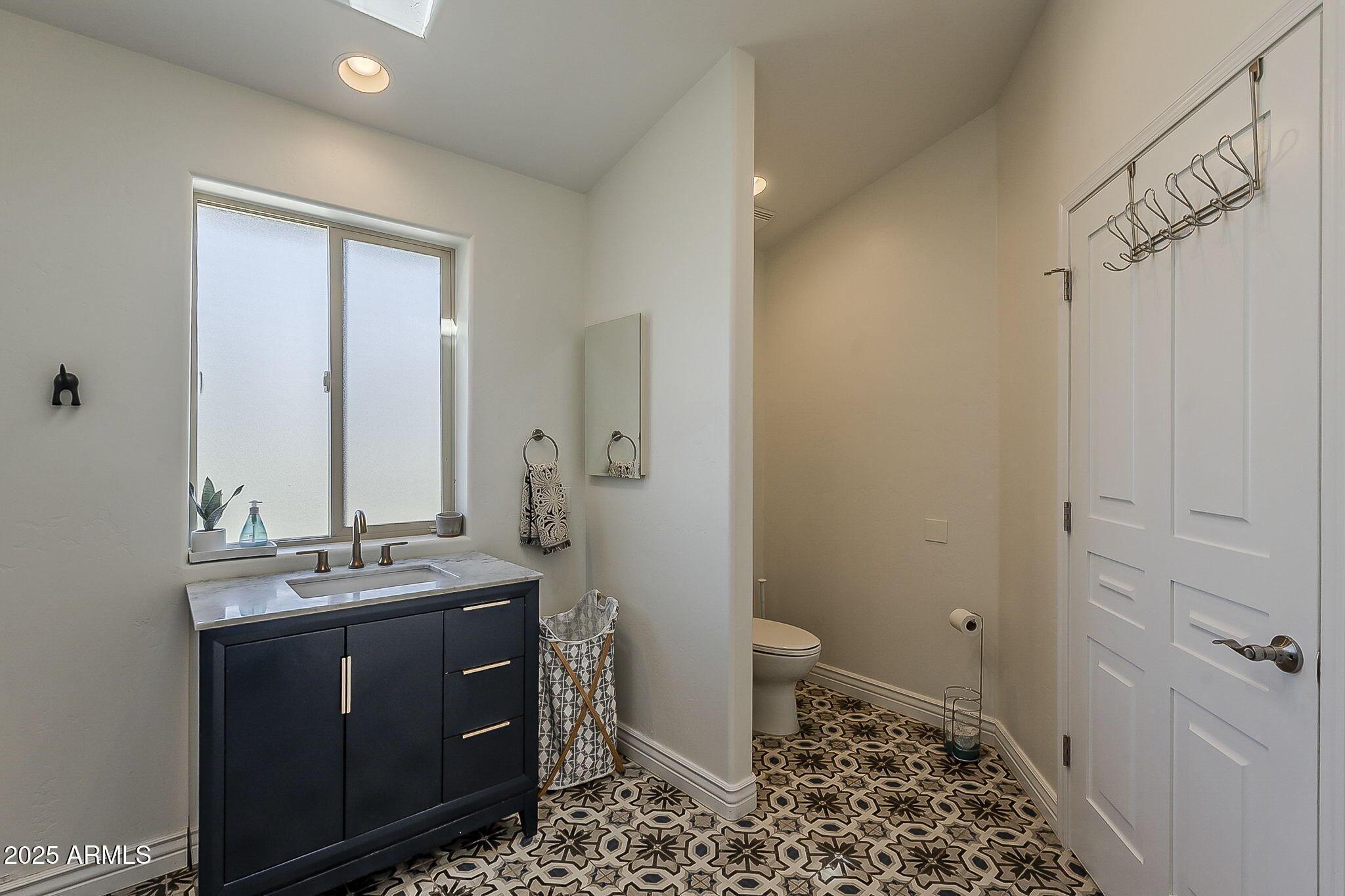 225 West Orchid Lane Phoenix, AZ 85021 - Photo 51 of 70 a bathroom with a sink a toilet and shower