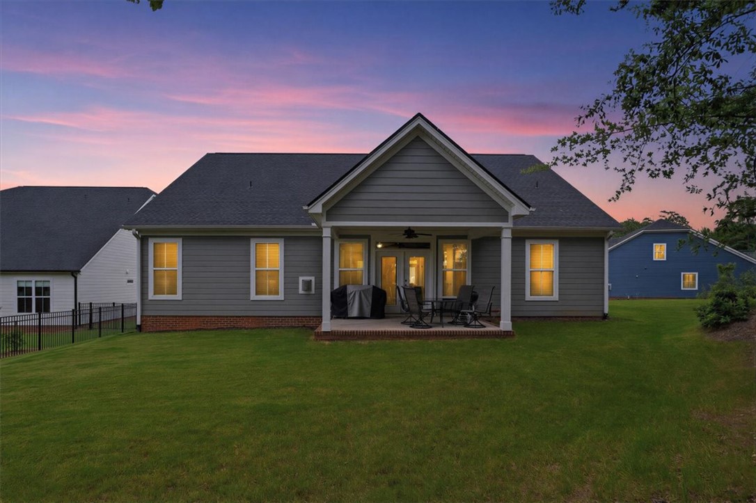 214 Timothy Court Anderson, SC 29621 - Photo 31 of 43 An inviting backyard patio offers a perfect spot for twilight relaxation and outdoor dining.