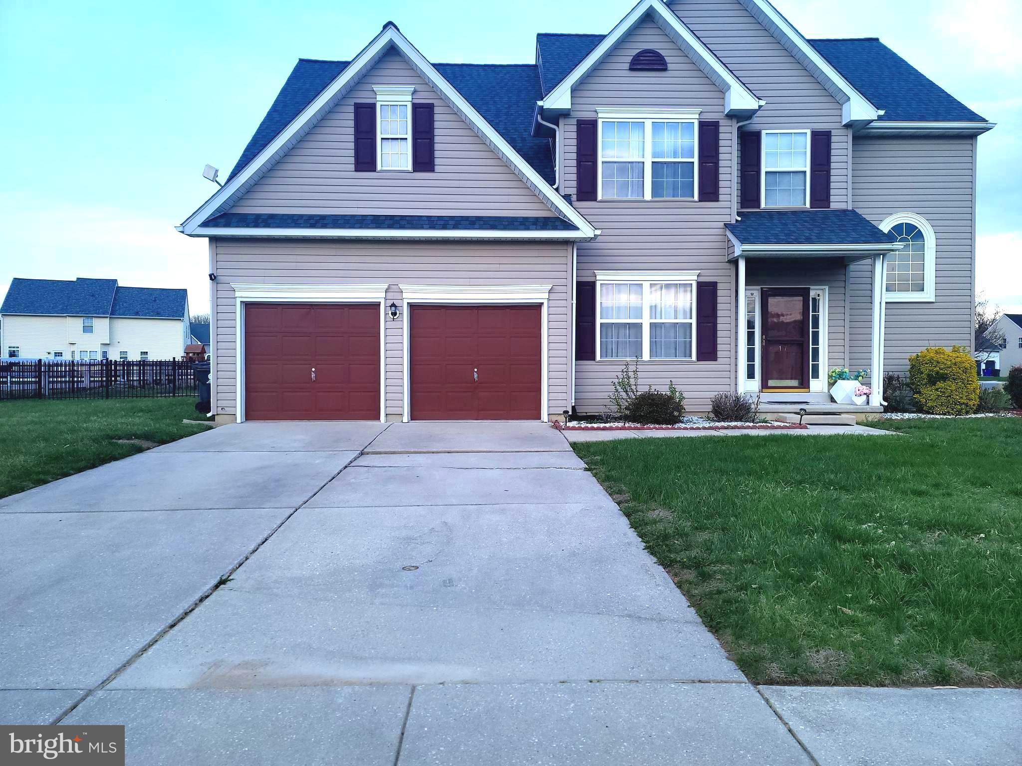 17 Brook Ramble Lane Townsend, DE 19734 - Photo 1 of 35 a front view of a house with a yard and garage