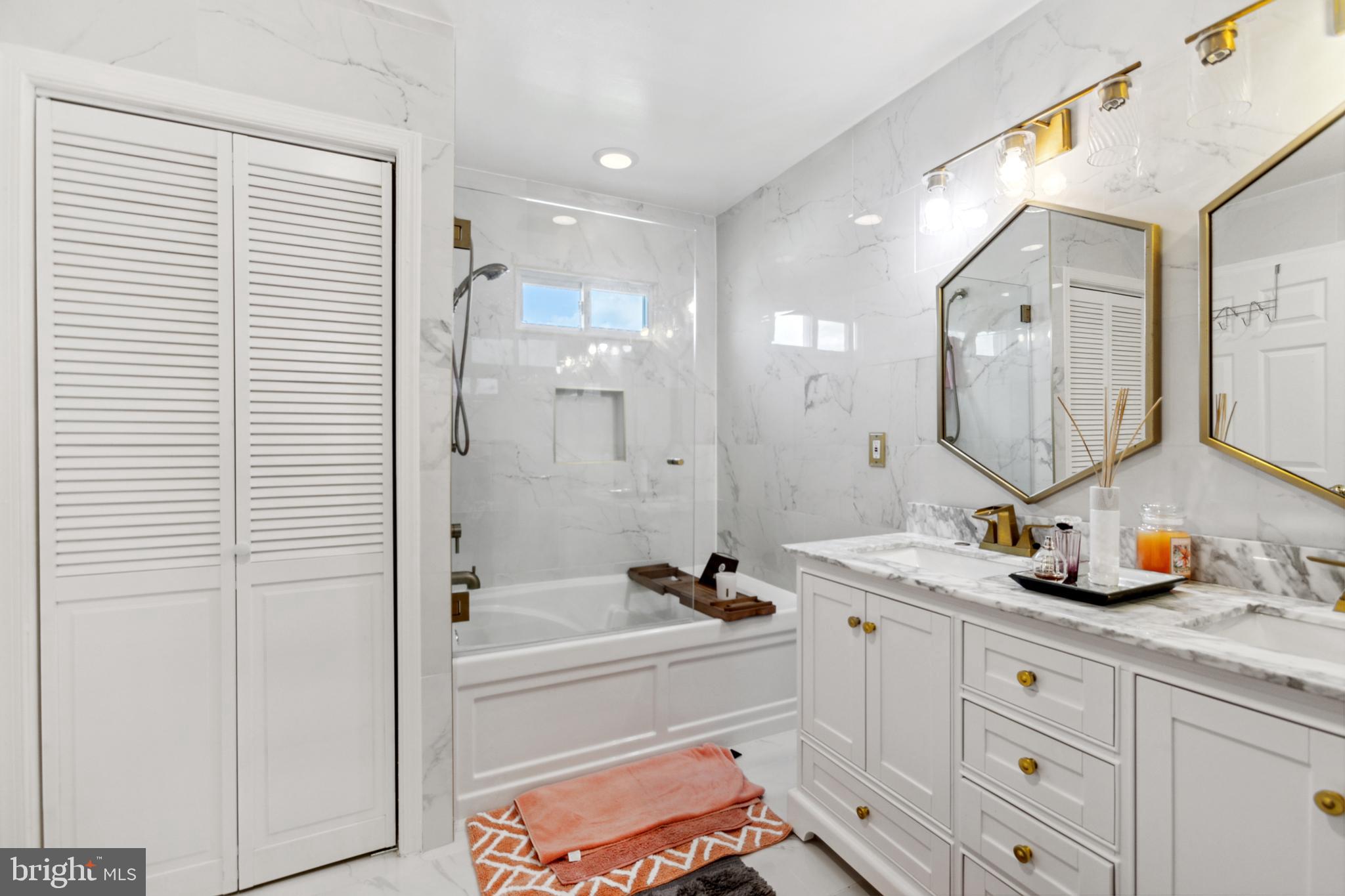 17 Brook Ramble Lane Townsend, DE 19734 - Photo 14 of 35 a spacious bathroom with a double vanity sink a mirror a shower and a bathtub