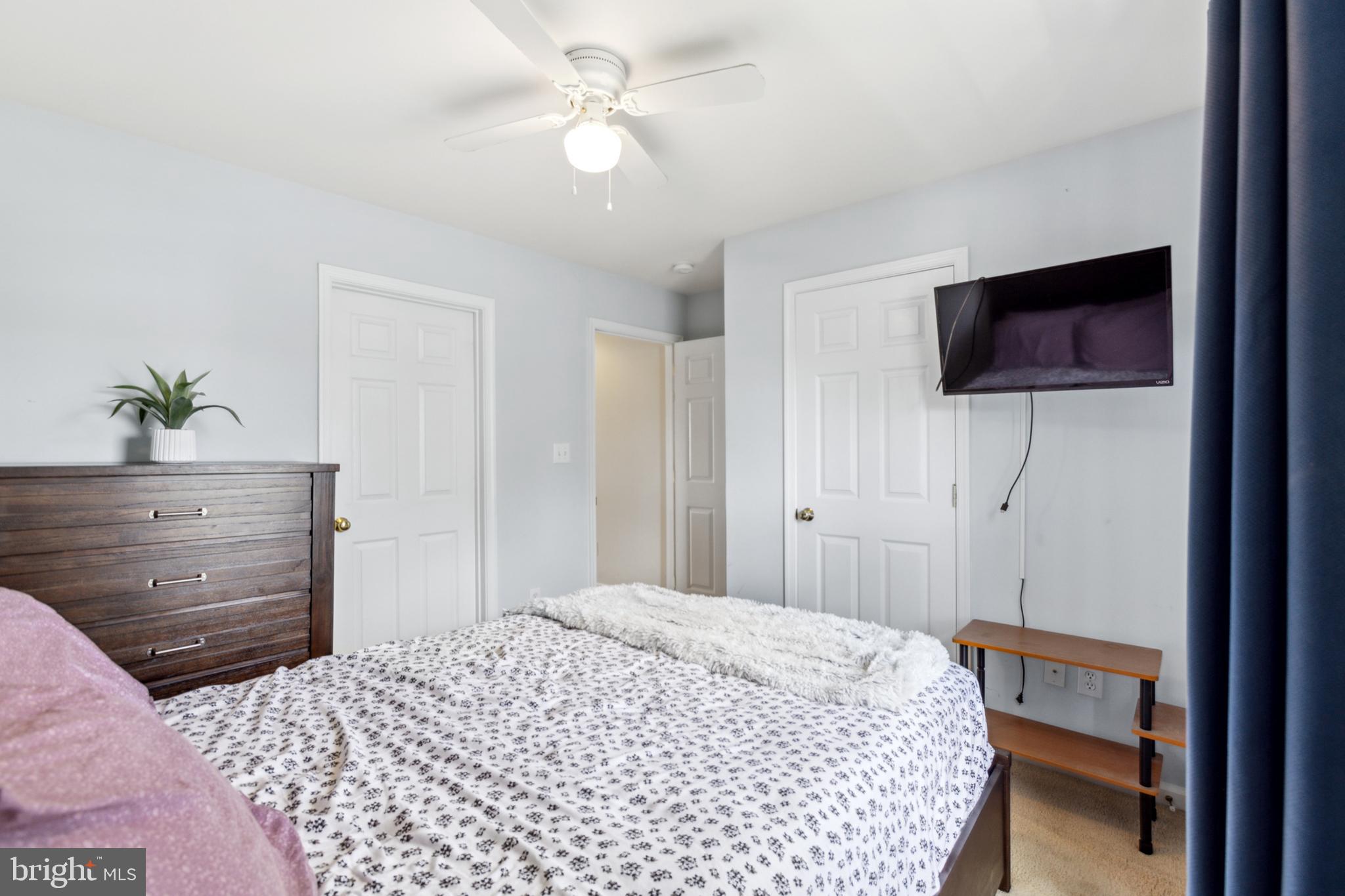 17 Brook Ramble Lane Townsend, DE 19734 - Photo 17 of 35 a bedroom with a bed and a flat screen tv