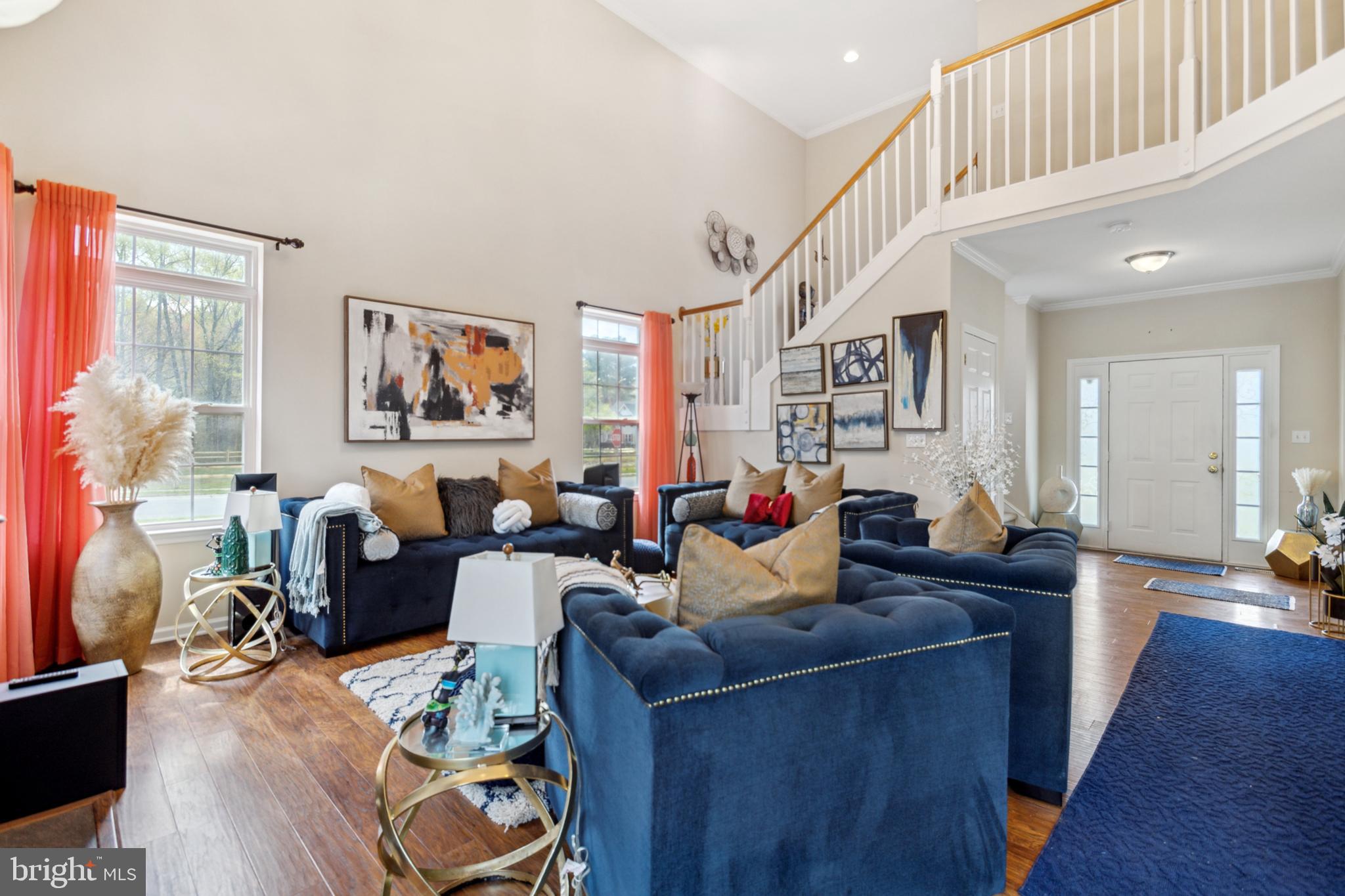 17 Brook Ramble Lane Townsend, DE 19734 - Photo 23 of 35 a living room with furniture and a wooden floor