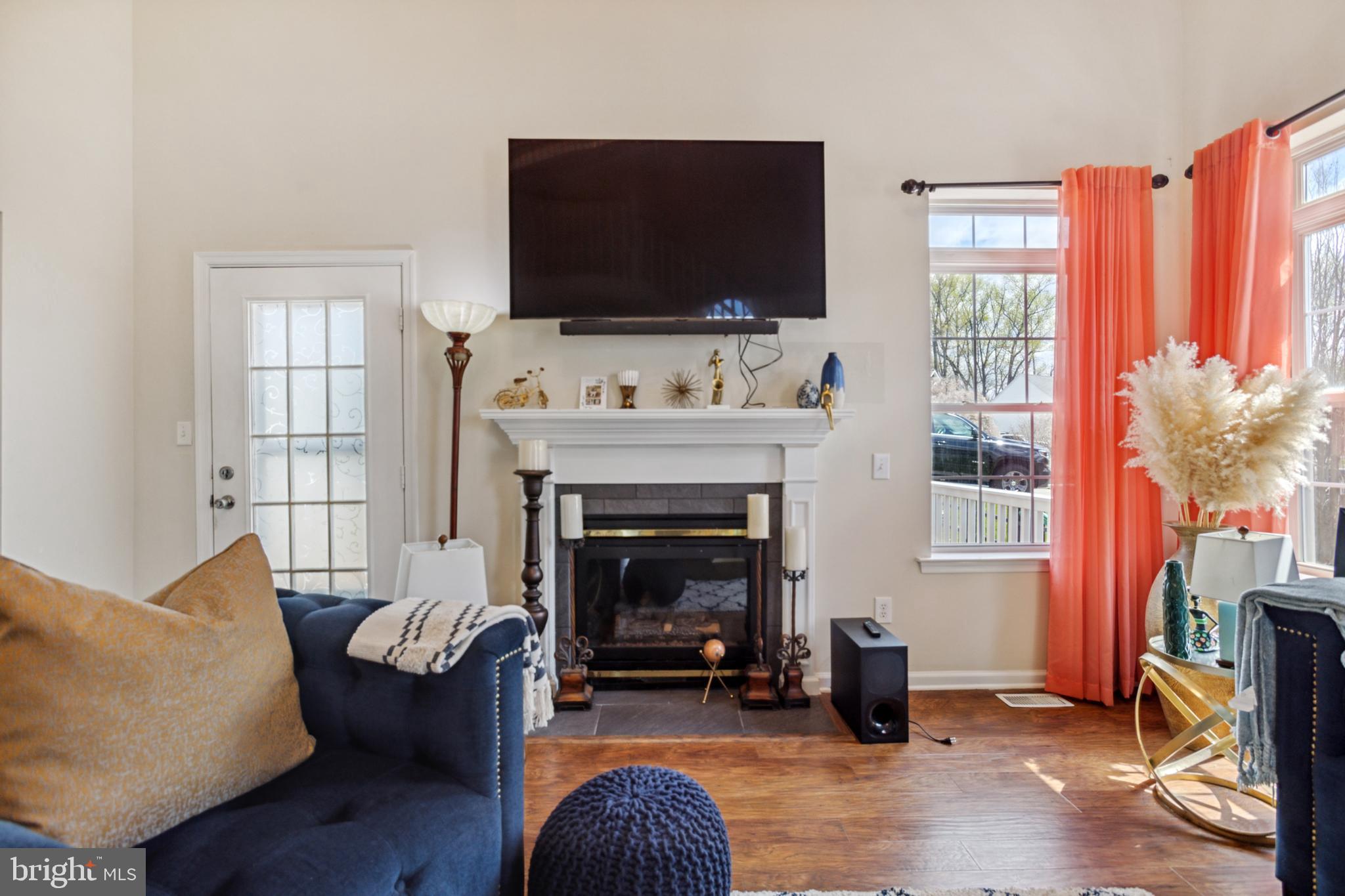 17 Brook Ramble Lane Townsend, DE 19734 - Photo 25 of 35 a living room with furniture and a fireplace