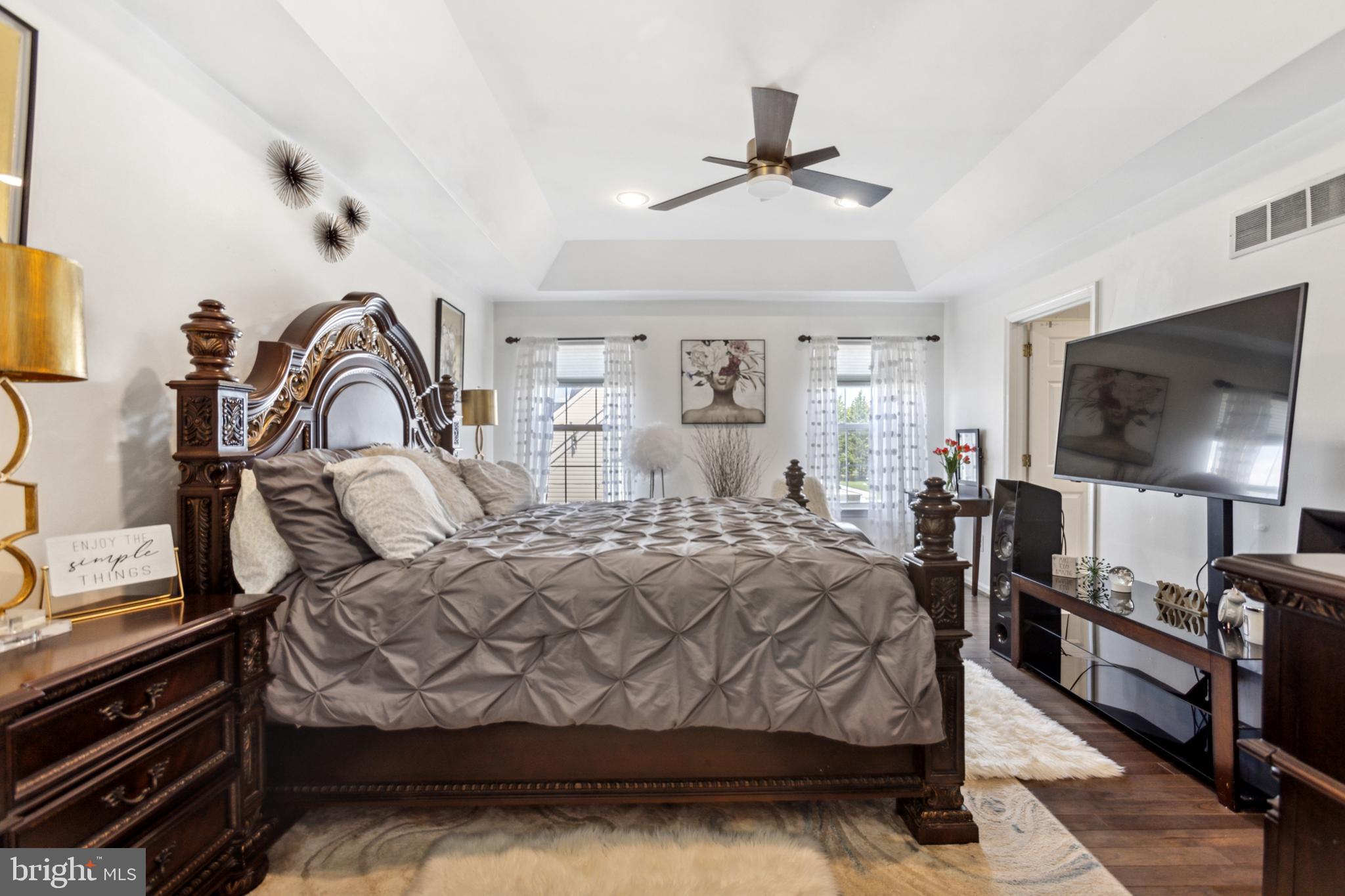17 Brook Ramble Lane Townsend, DE 19734 - Photo 28 of 35 a bedroom with a bed and a flat tv screen on the dresser