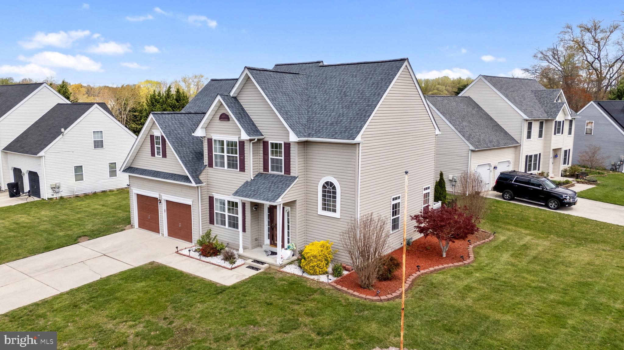 17 Brook Ramble Lane Townsend, DE 19734 - Photo 3 of 35 a front view of house with yard outdoor seating and barbeque oven
