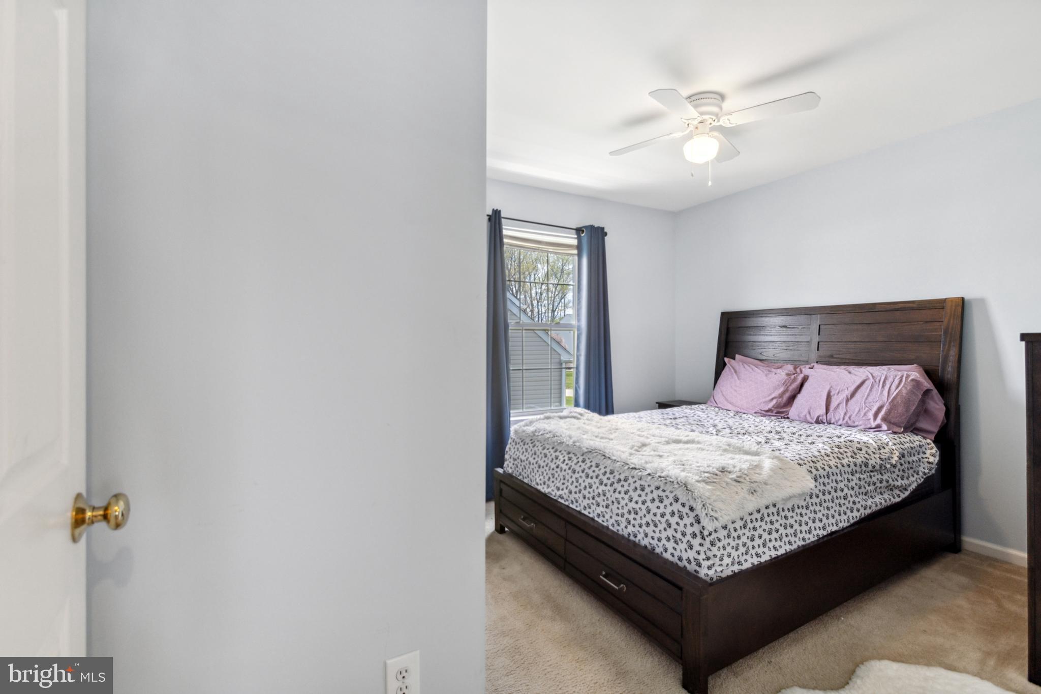 17 Brook Ramble Lane Townsend, DE 19734 - Photo 32 of 35 a bedroom with a bed and window