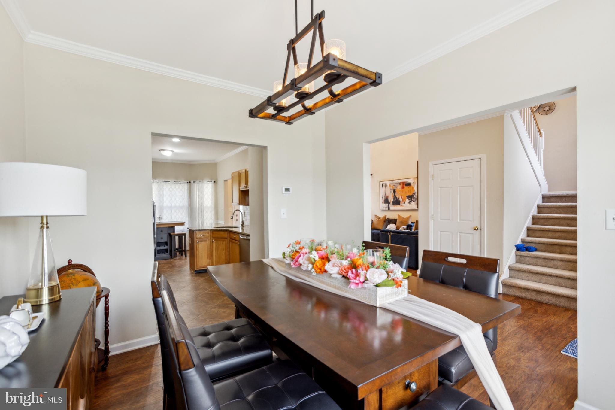 17 Brook Ramble Lane Townsend, DE 19734 - Photo 7 of 35 a view of a dining room with furniture and wooden floor