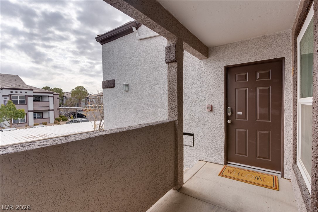 7255 West Sunset Road, Unit 2155 Las Vegas, NV 89113 - Photo 6 of 21 View of exterior entry featuring stucco siding
