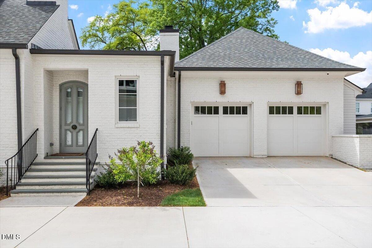 2123 St Marys Street Raleigh, NC 27608 - Photo 68 of 77 a front view of a house with a garden