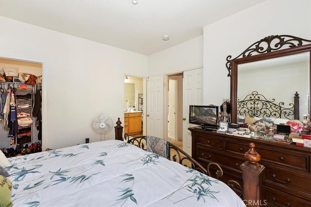 7331 Shelby Place, Unit U140 Rancho Cucamonga, CA 91739 - Photo 14 of 23 a bedroom with a bed and a dresser