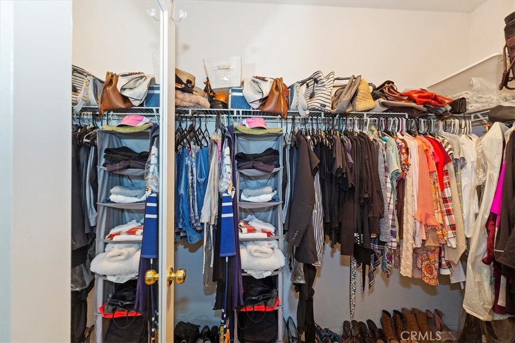 7331 Shelby Place, Unit U140 Rancho Cucamonga, CA 91739 - Photo 15 of 23 a view of walk in closet with clothes and shoes