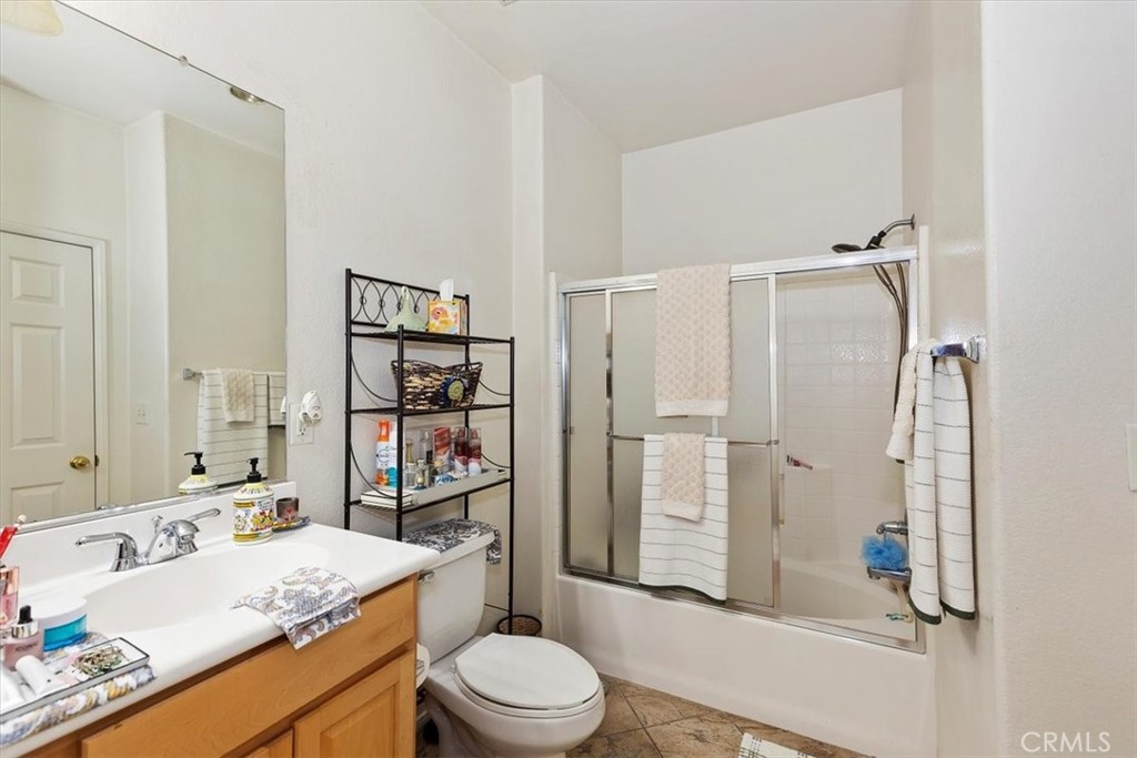 7331 Shelby Place, Unit U140 Rancho Cucamonga, CA 91739 - Photo 16 of 23 a bathroom with a sink a toilet and shower