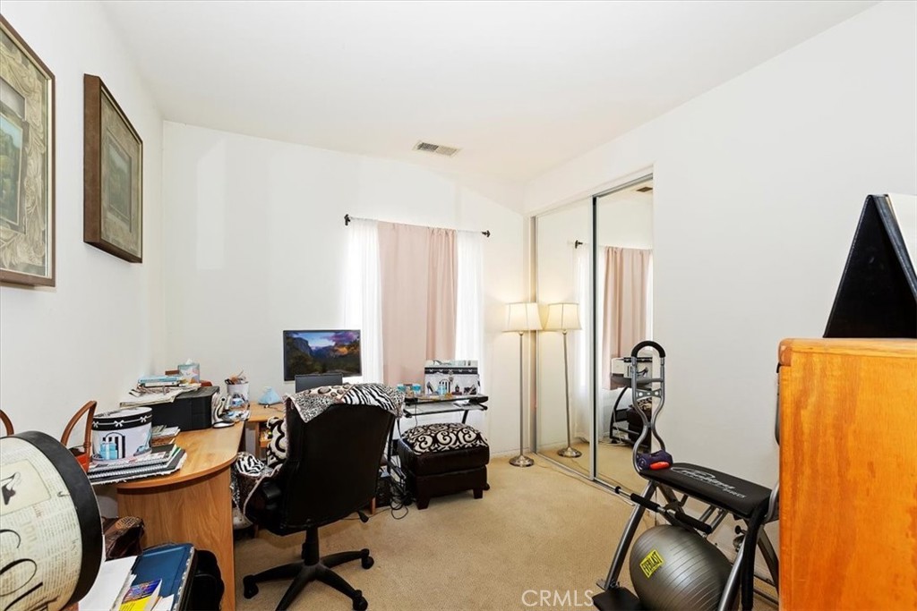 7331 Shelby Place, Unit U140 Rancho Cucamonga, CA 91739 - Photo 18 of 23 a room with furniture and gym equipment