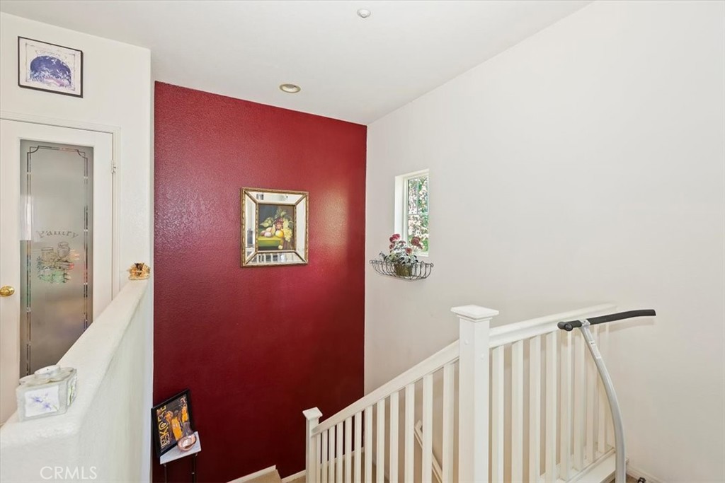 7331 Shelby Place, Unit U140 Rancho Cucamonga, CA 91739 - Photo 23 of 23 a view of a hallway with a workspace