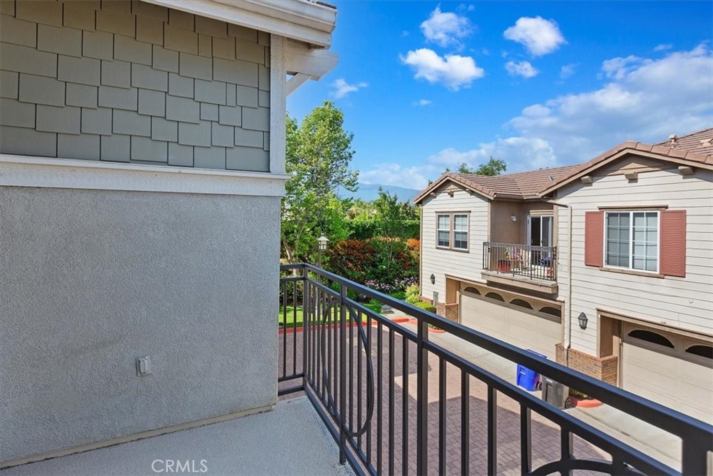 7331 Shelby Place, Unit U140 Rancho Cucamonga, CA 91739 - Photo 3 of 23 a view of a house with a balcony