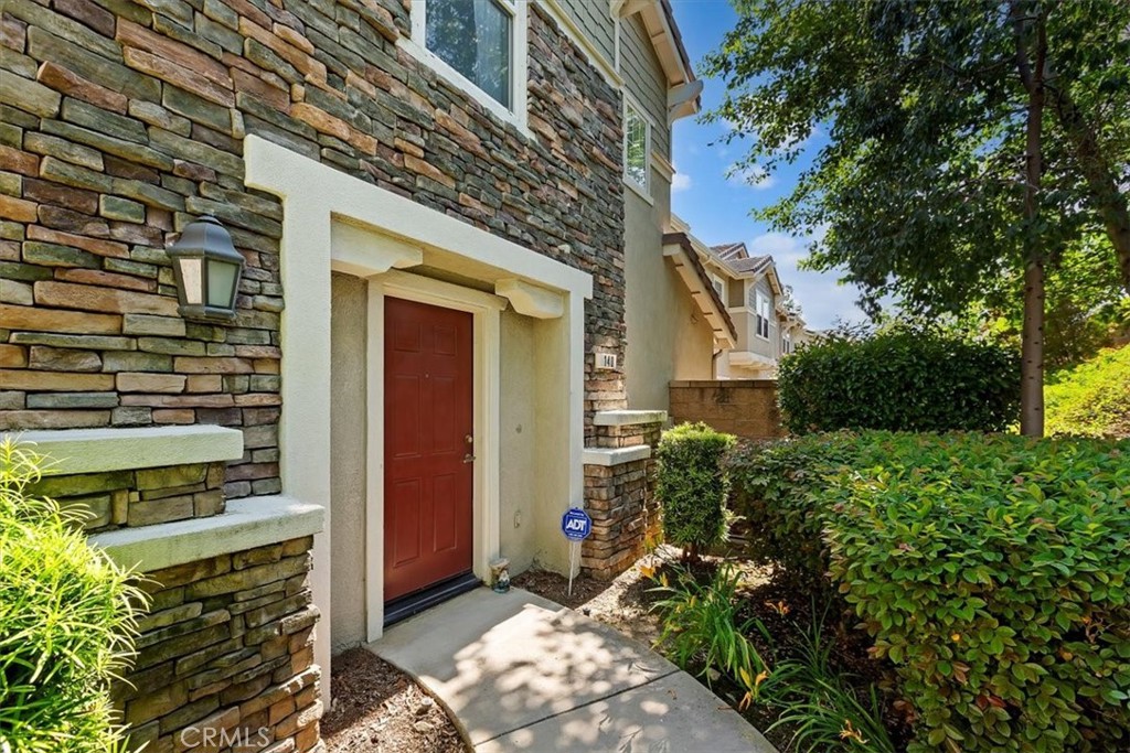 7331 Shelby Place, Unit U140 Rancho Cucamonga, CA 91739 - Photo 4 of 23 a view of a house with a yard