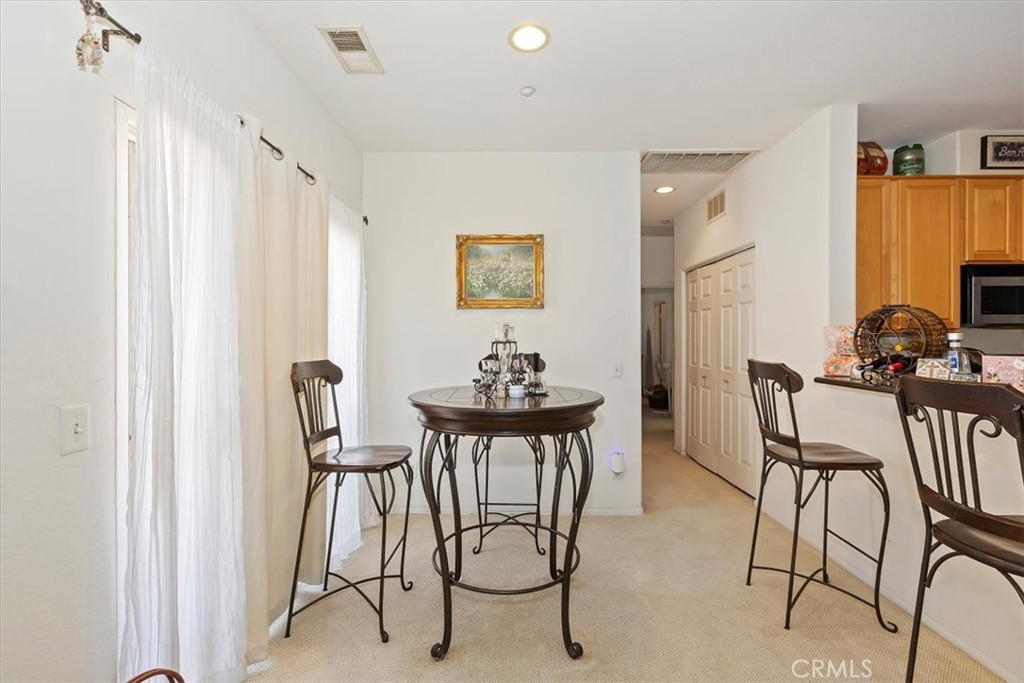 7331 Shelby Place, Unit U140 Rancho Cucamonga, CA 91739 - Photo 10 of 23 a dining room with furniture and window