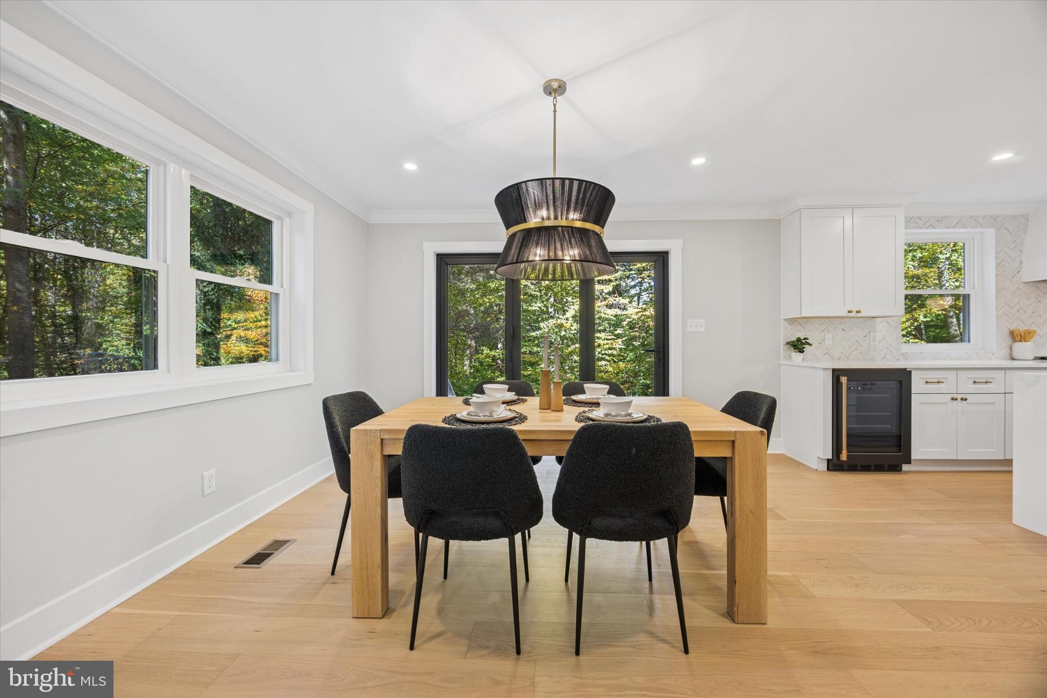 3053 Sidley Hill Road Malvern, PA 19355 - Photo 11 of 53 a dining room with furniture a chandelier and wooden floor