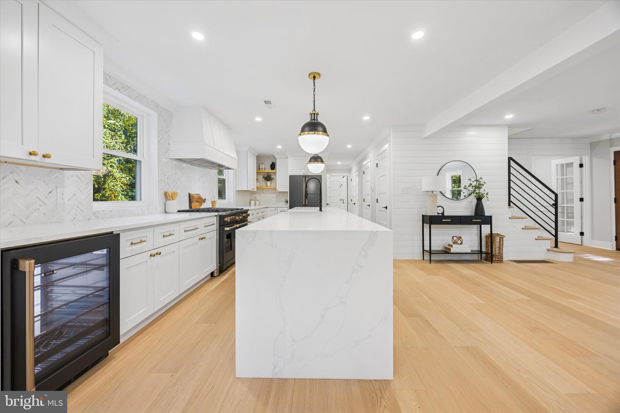 3053 Sidley Hill Road Malvern, PA 19355 - Photo 18 of 53 a large kitchen with cabinets a sink a window and stainless steel appliances