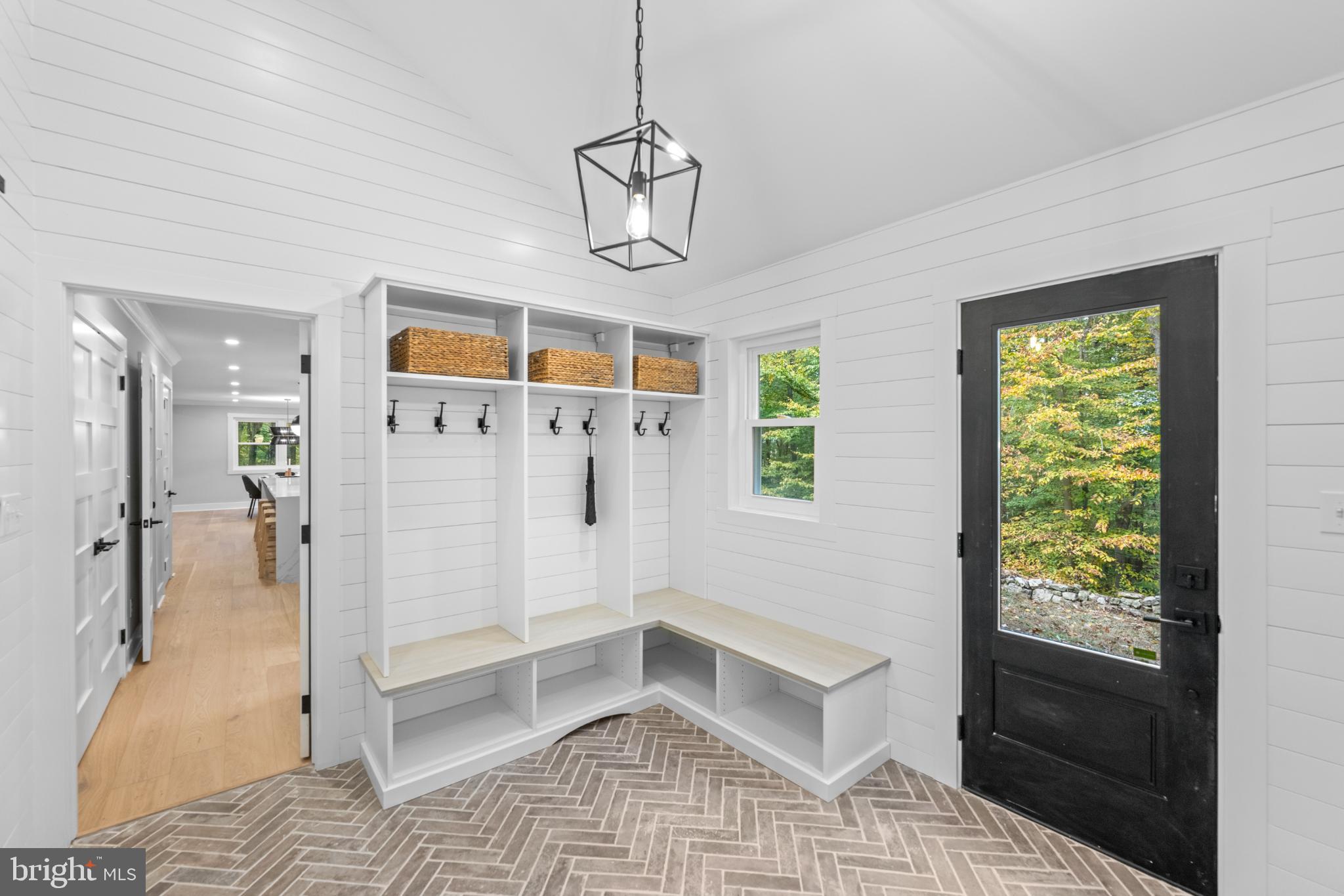 3053 Sidley Hill Road Malvern, PA 19355 - Photo 21 of 53 a view of a hallway with windows and chandelier