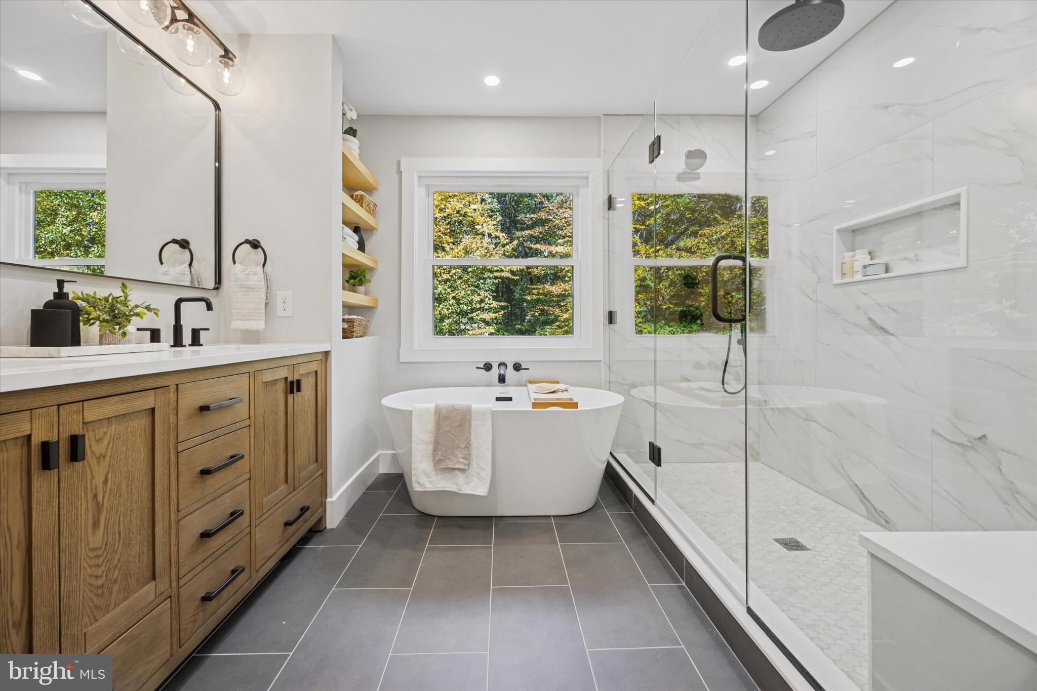 3053 Sidley Hill Road Malvern, PA 19355 - Photo 32 of 53 a bathroom with a double vanity sink a toilet and bathtub