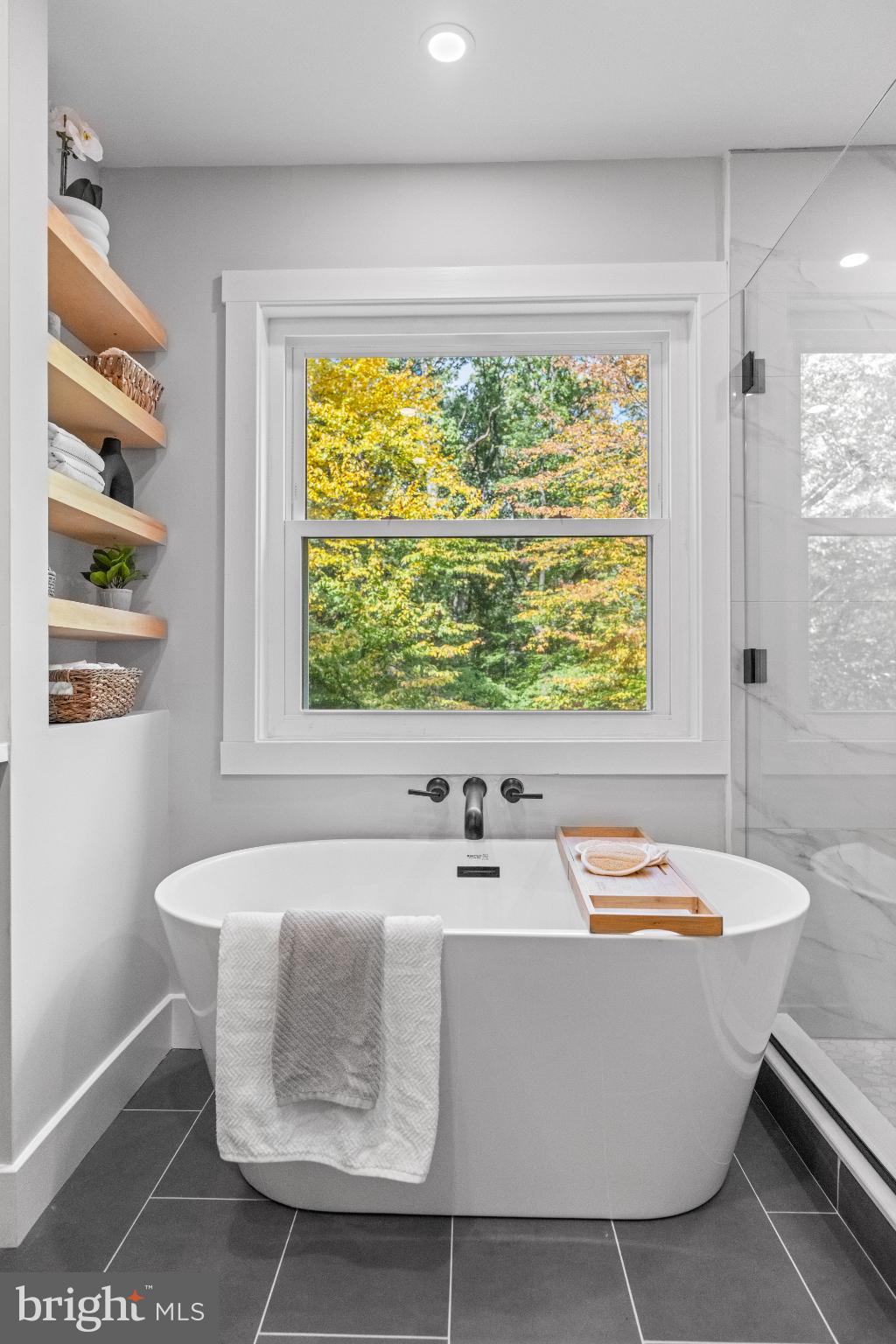 3053 Sidley Hill Road Malvern, PA 19355 - Photo 35 of 53 a white bath tub sitting in a bathroom next to a window