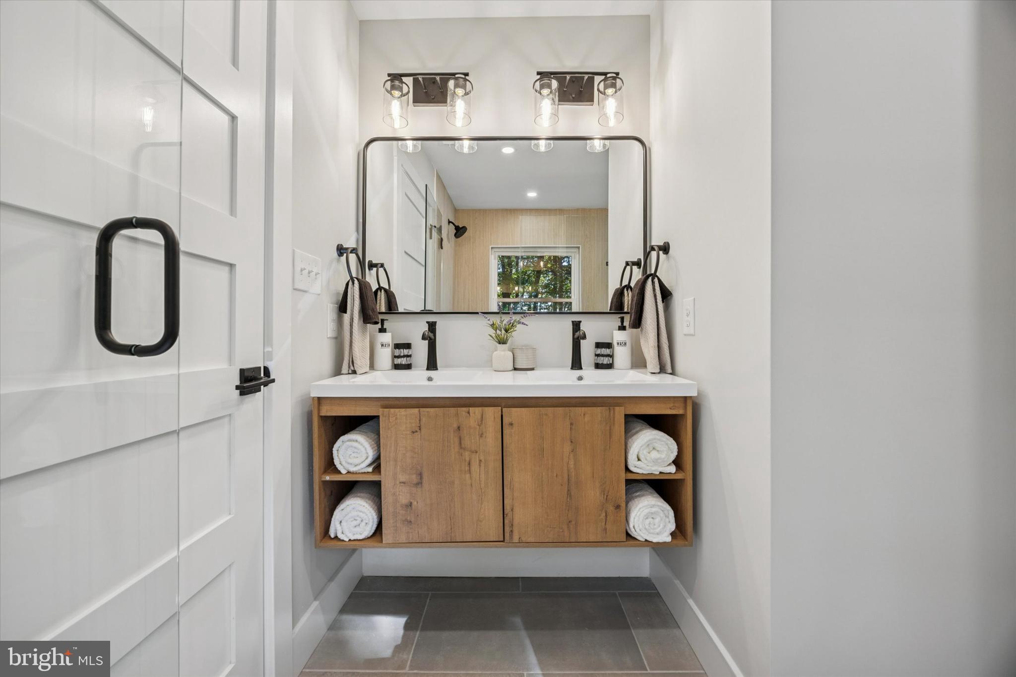 3053 Sidley Hill Road Malvern, PA 19355 - Photo 43 of 53 a bathroom with a sink and a mirror
