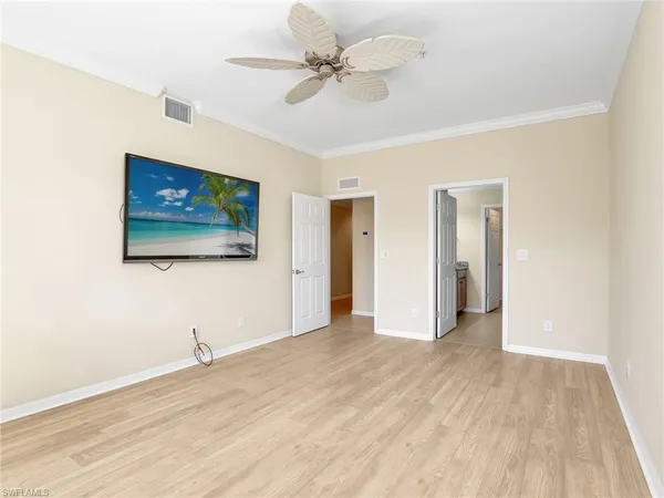a bathroom with a granite countertop sink a toilet and a mirror