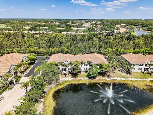 a front view of a house with garden and sitting area