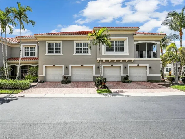 a view of a kitchen with a sink and chandelier