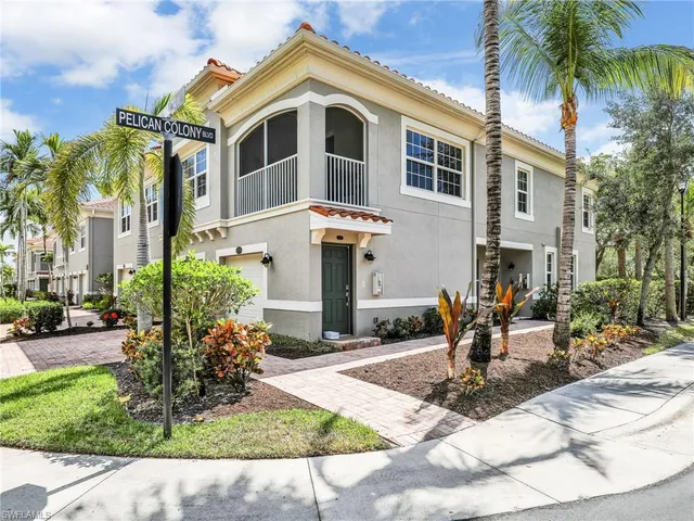 a kitchen with stainless steel appliances granite countertop a refrigerator a sink a stove and oven