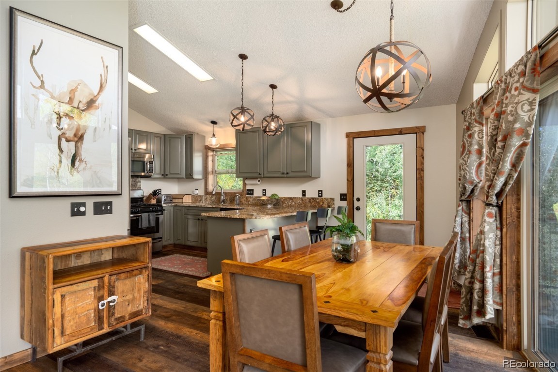 58195 Jupiter Place Clark, CO 80428 - Photo 13 of 29 a view of a dining room with furniture window and wooden floor