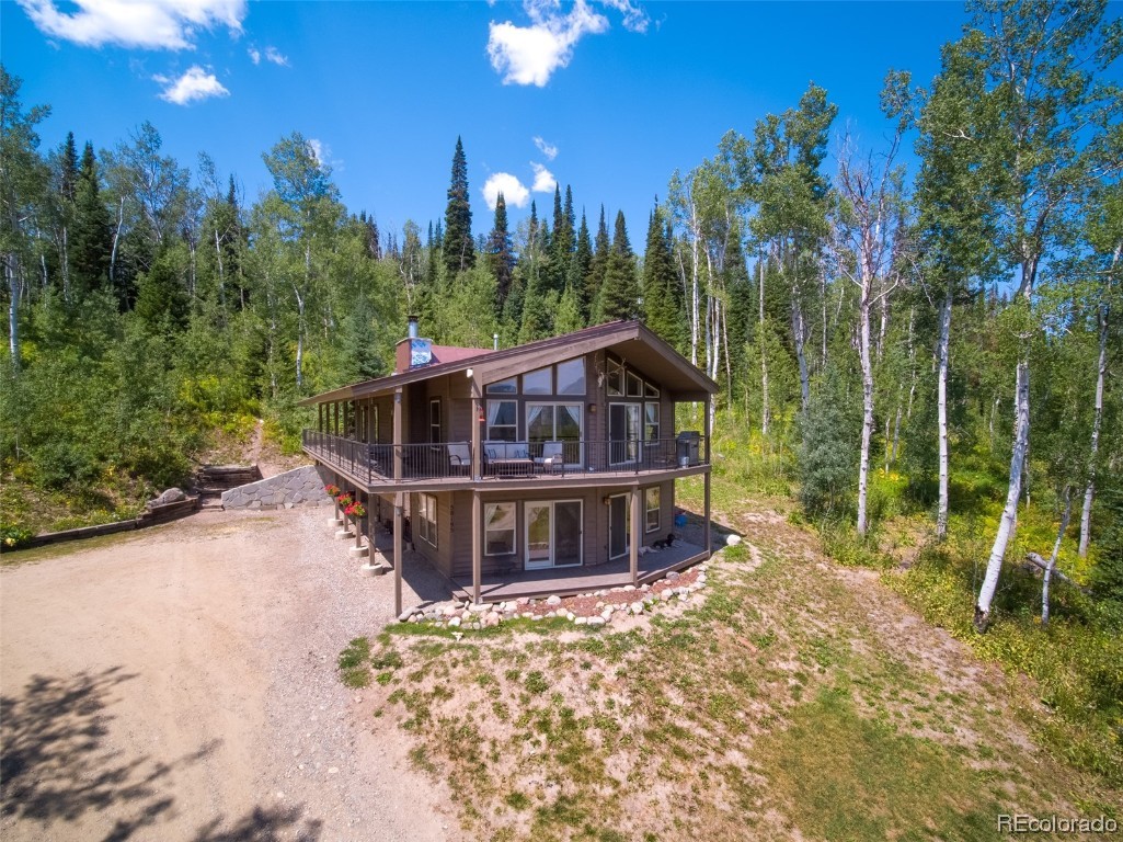 58195 Jupiter Place Clark, CO 80428 - Photo 2 of 29 a view of a house with a yard