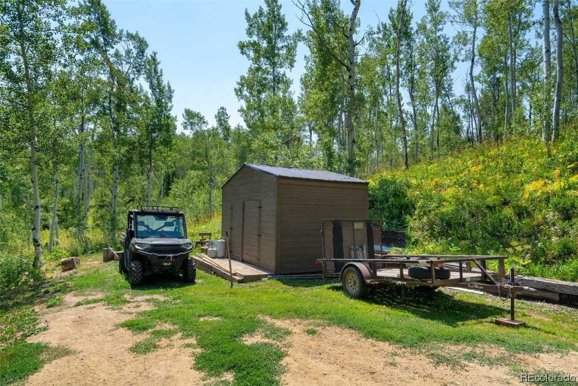 58195 Jupiter Place Clark, CO 80428 - Photo 26 of 29 a view of a house with a back yard
