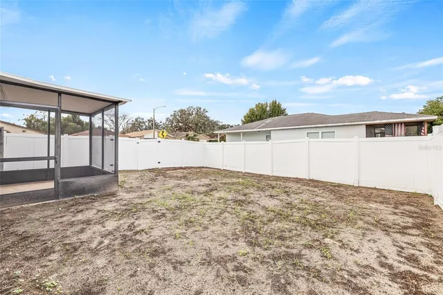 a view of a backyard of the house
