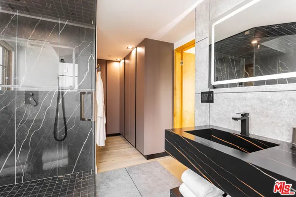a bath room with a washer and dryer