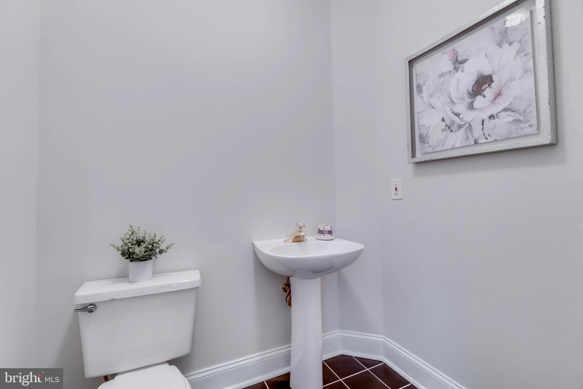 1318 Sundial Drive Reston, VA 20194 - Photo 24 of 52 Powder room, off stair going to lower level (LL)